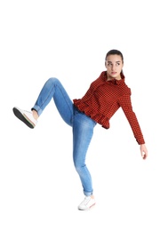 Young woman attracted to magnet on white background