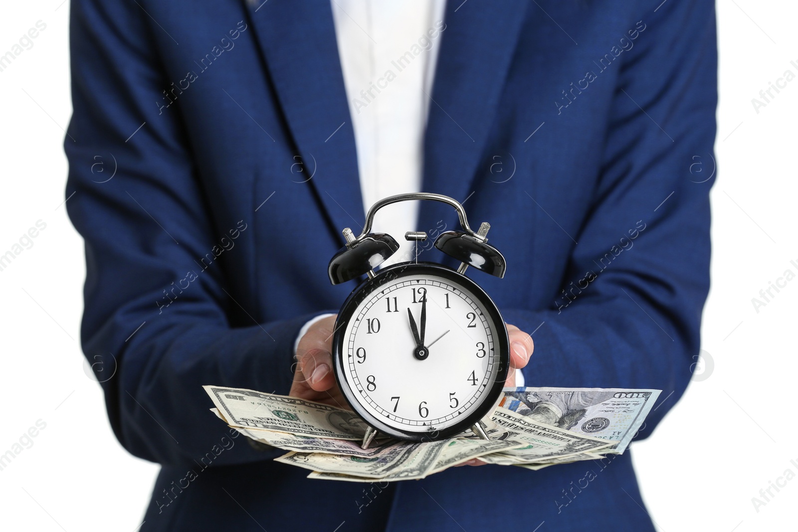 Photo of Businesswoman holding alarm clock and cash on white background. Time is money concept