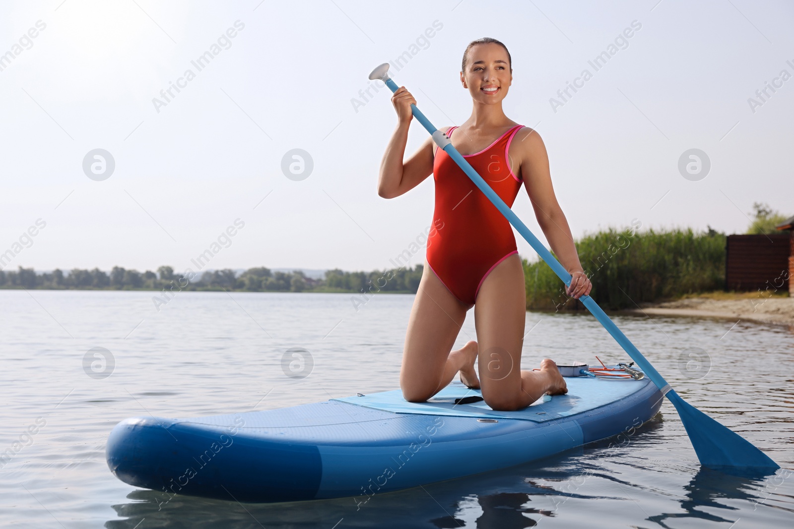 Photo of Woman paddle boarding on SUP board in sea