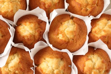 Photo of Tasty muffins as background, top view. Fresh pastry