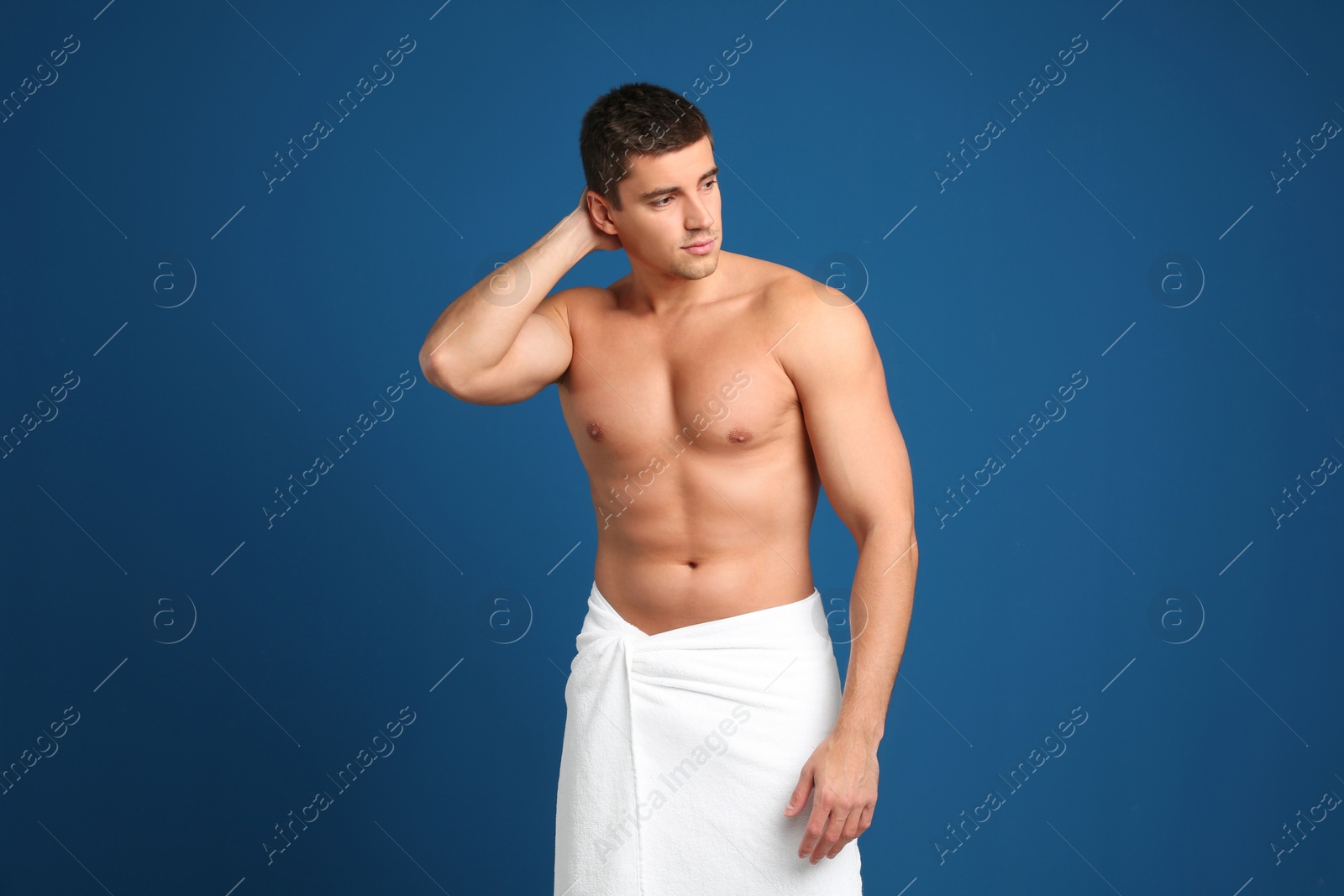 Photo of Man with sexy body on blue background