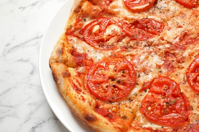Photo of Hot cheese pizza Margherita on marble table, closeup