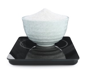 Photo of Modern kitchen scale with bowl of sugar isolated on white