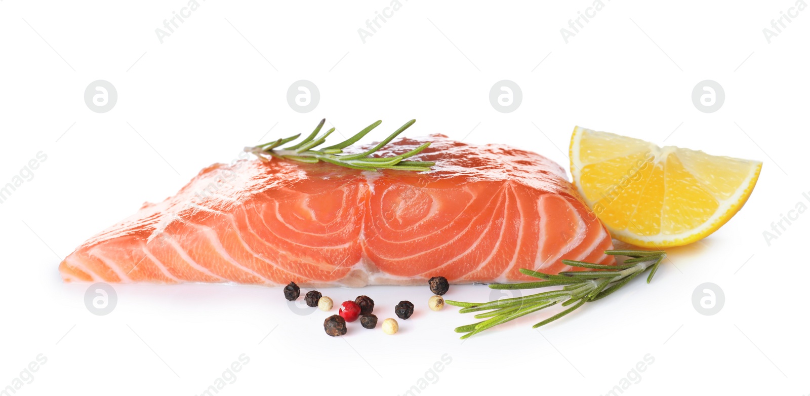 Photo of Fresh raw salmon with pepper, lemon and rosemary on white background. Fish delicacy