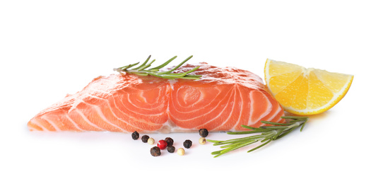 Photo of Fresh raw salmon with pepper, lemon and rosemary on white background. Fish delicacy