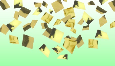 Shiny golden confetti falling on gradient light green background. Banner design