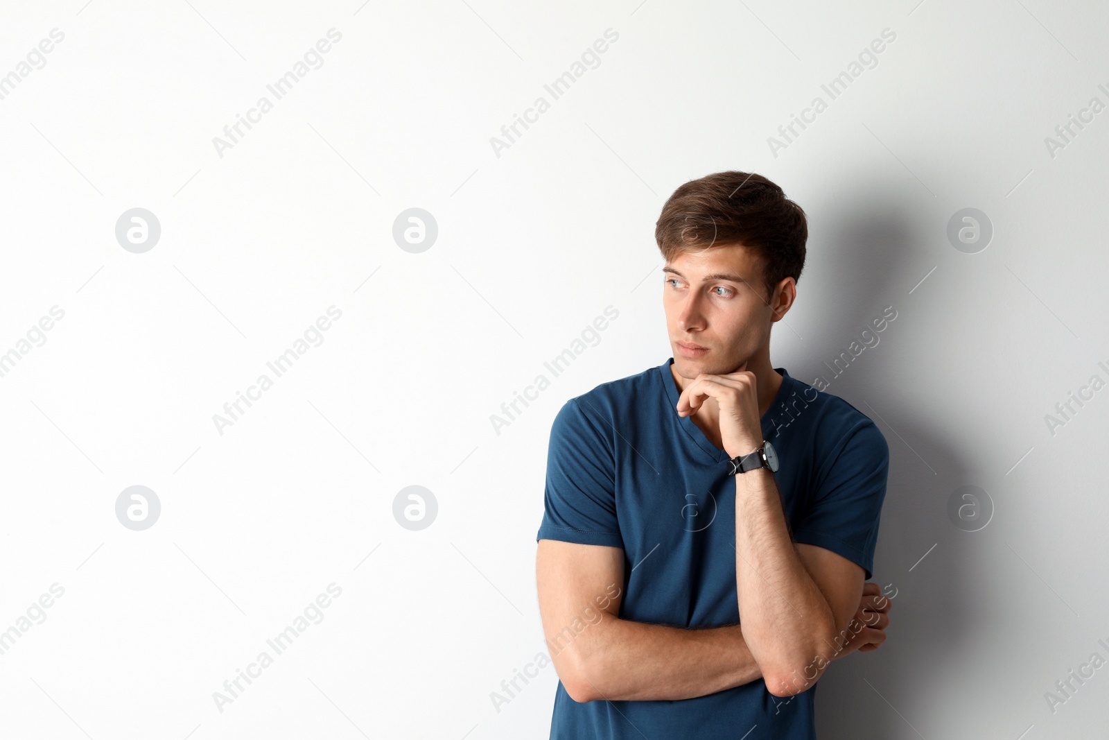 Photo of Portrait of handsome man on light background. Space for text