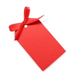 Photo of Blank red gift tag with satin ribbon on white background, top view