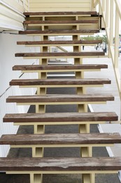 Photo of View of old shabby wooden stairs outdoors