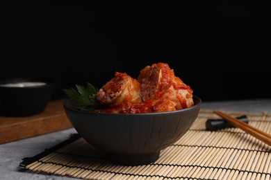 Photo of Delicious stuffed cabbage rolls on grey table, space for text