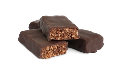 Photo of Halves of tasty chocolate glazed protein bar on white background