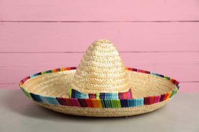 Mexican sombrero hat on grey table, closeup