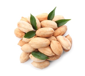 Photo of Heap of pecan nuts in shell and leaves on white background, top view