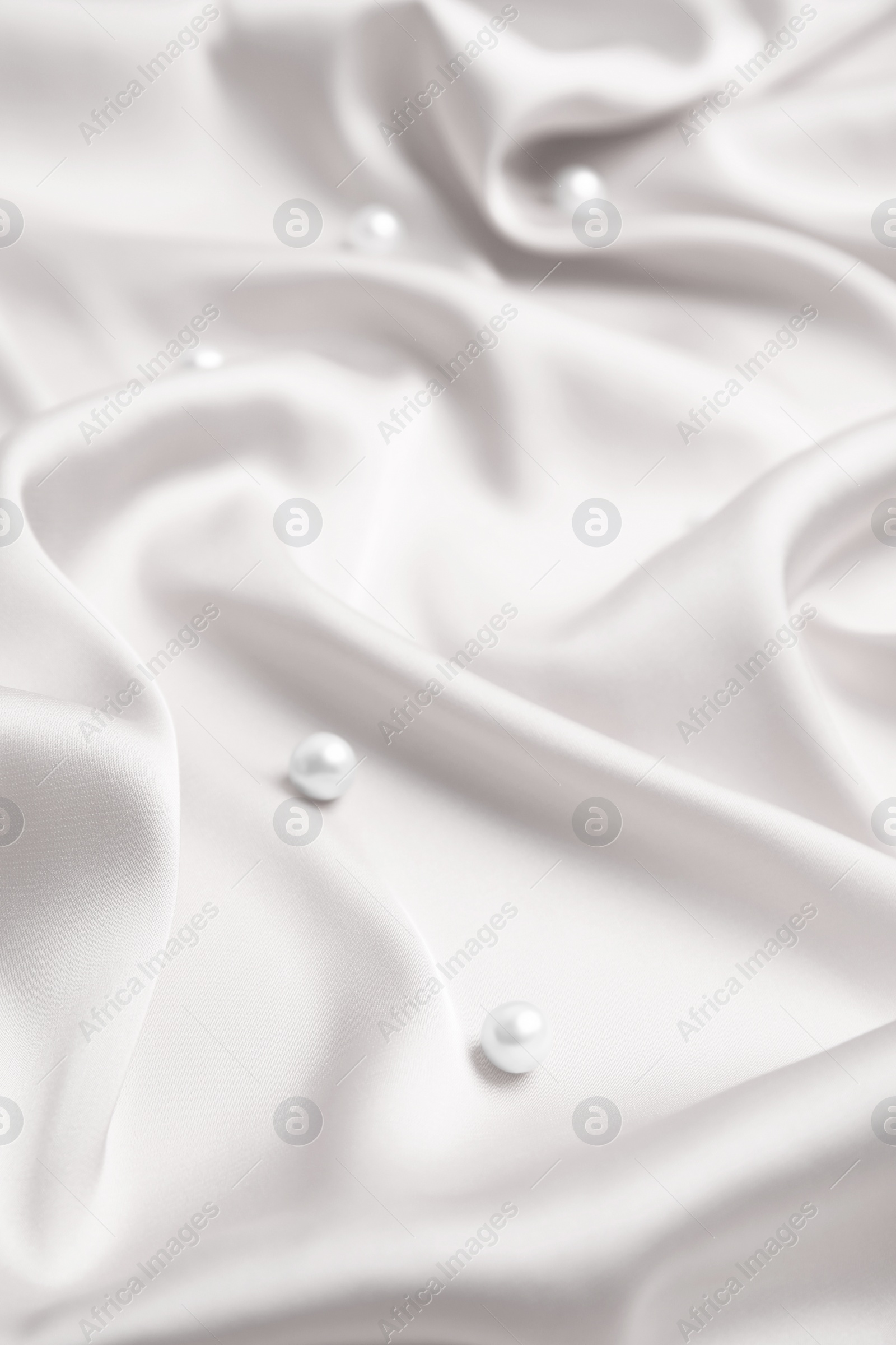Image of Many beautiful pearls on delicate white silk
