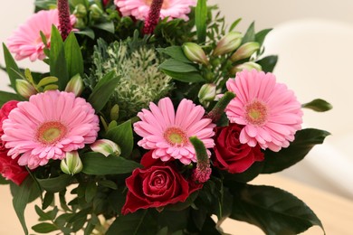 Bouquet of beautiful flowers on light background, closeup