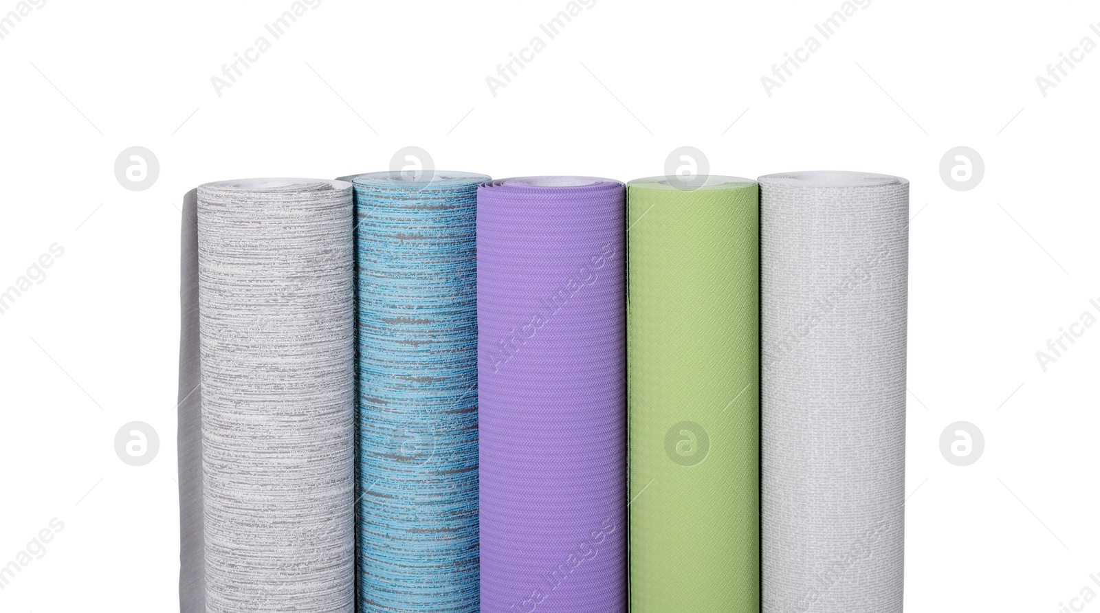 Photo of Many different wallpaper rolls isolated on white