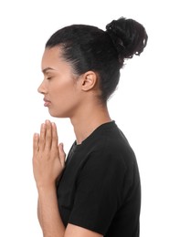 Photo of African American woman with clasped hands praying to God on white background