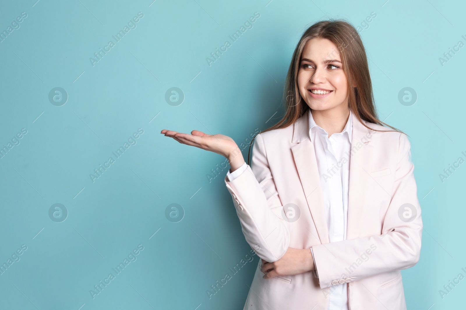 Photo of Beautiful real estate agent on color background