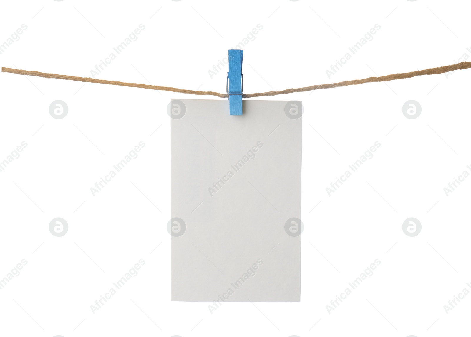 Photo of Clothespin with empty notepaper on string against white background. Space for text