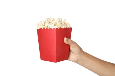 Woman holding bucket with delicious popcorn on white background, closeup