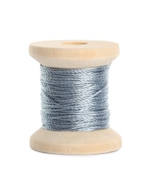 Photo of Wooden spool of silver sewing thread isolated on white