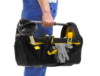 Photo of Mature plumber with tool bag on white background