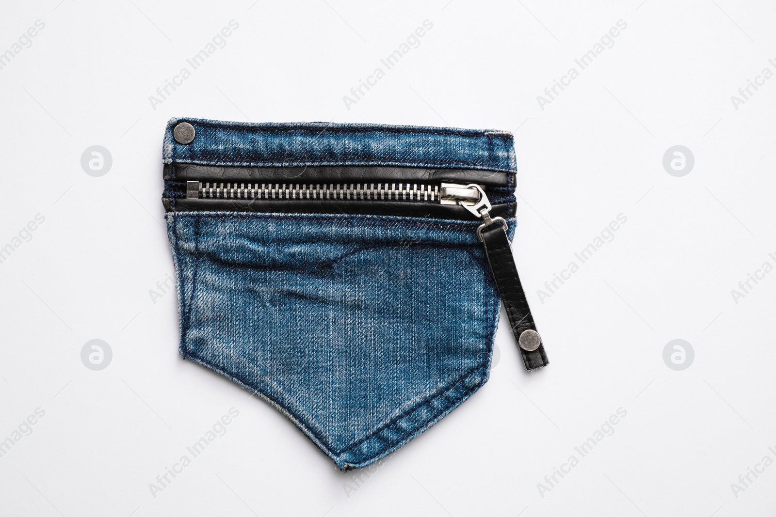 Photo of Stylish jeans pocket with zipper isolated on white, top view