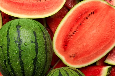 Photo of Halves of juicy ripe watermelon as background, top view