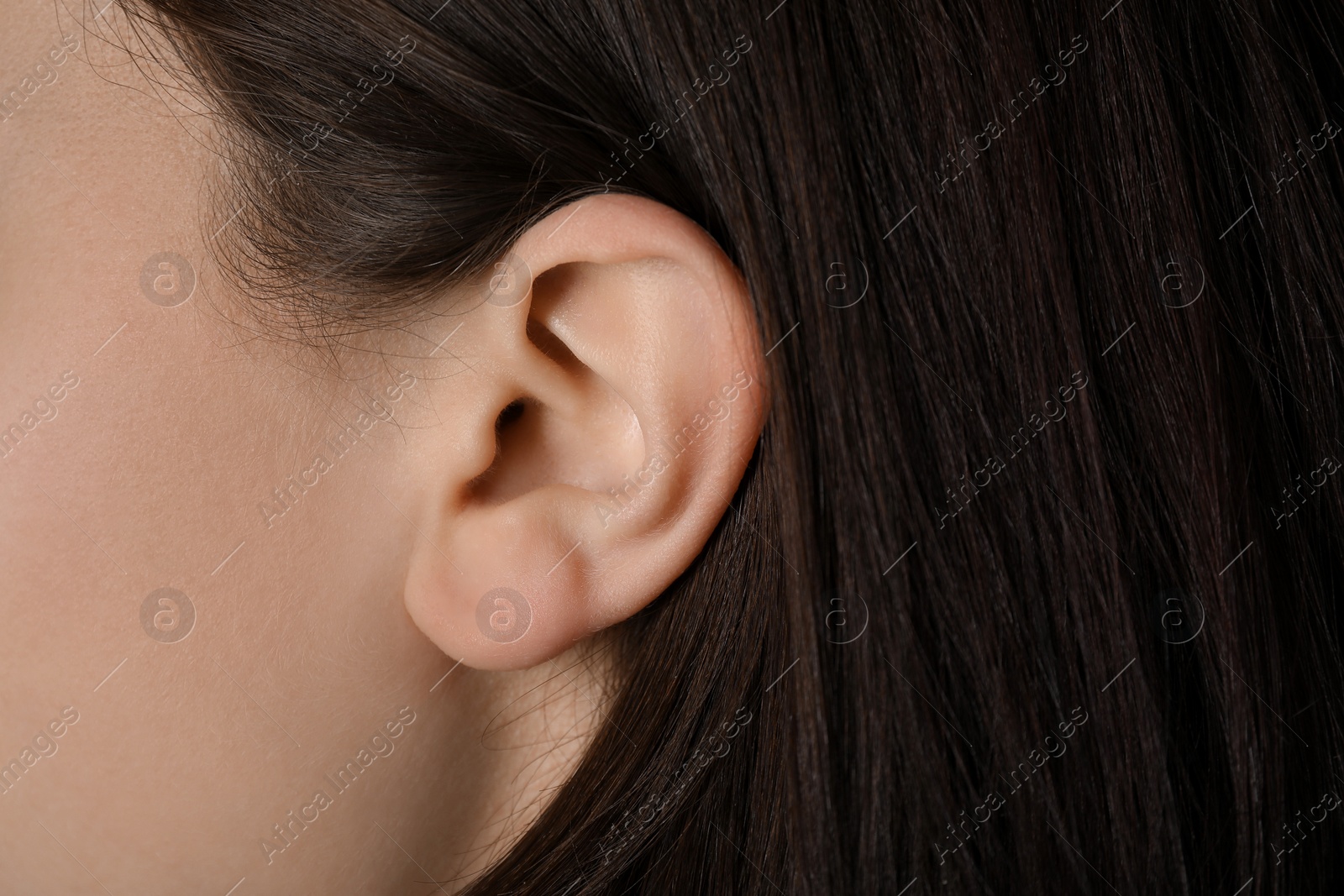 Photo of Closeup view of woman, focus on ear