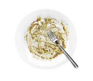 Dirty plate and fork on white background, top view