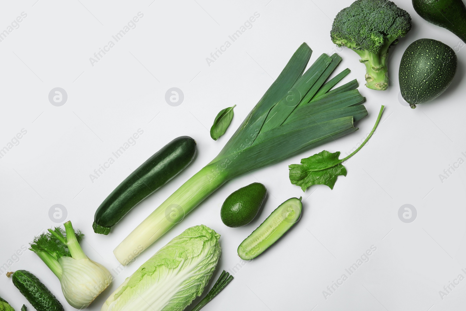 Photo of Flat lay composition with fresh ripe vegetables on white background