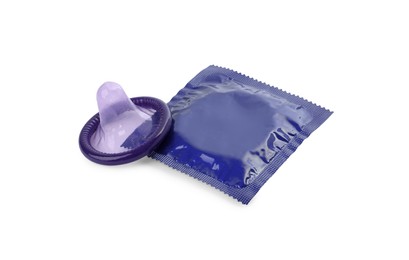 Photo of Unpacked condom and package on white background. Safe sex