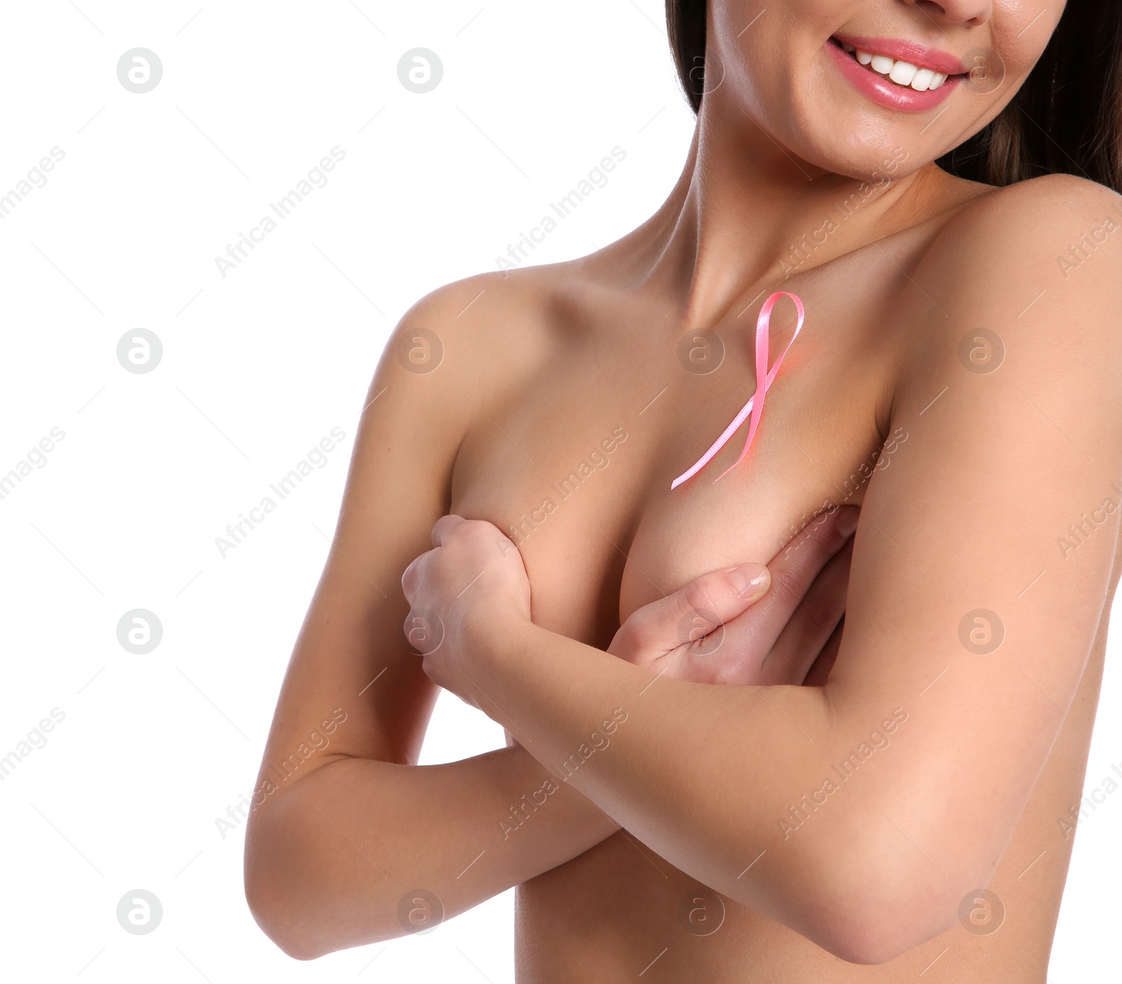 Photo of Naked woman with silk ribbon on white background, closeup. Breast cancer awareness concept