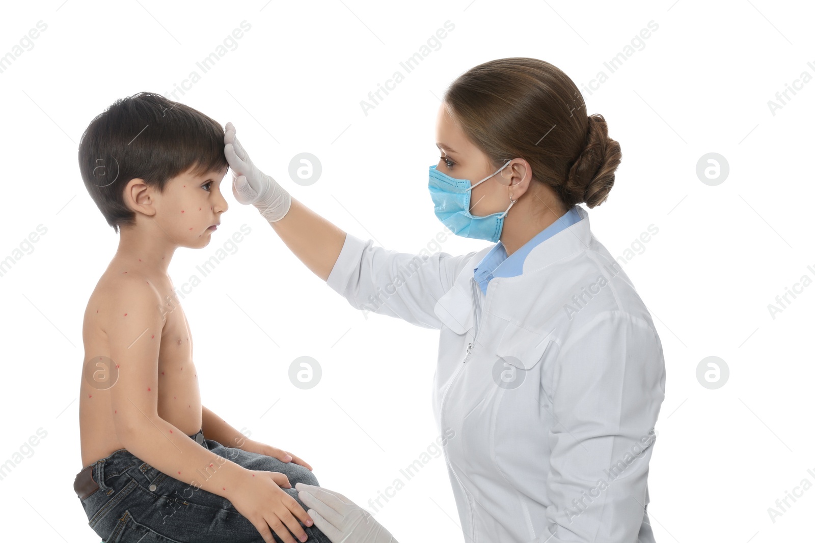 Photo of Doctor examining little boy with chickenpox on white background. Varicella zoster virus