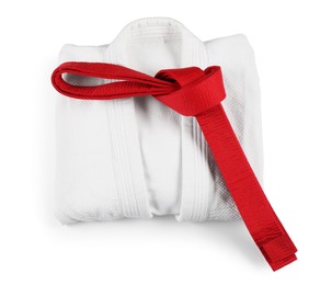 Photo of Martial arts uniform with red belt isolated on white, top view