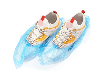 Pair of sneakers in medical blue covers on white background