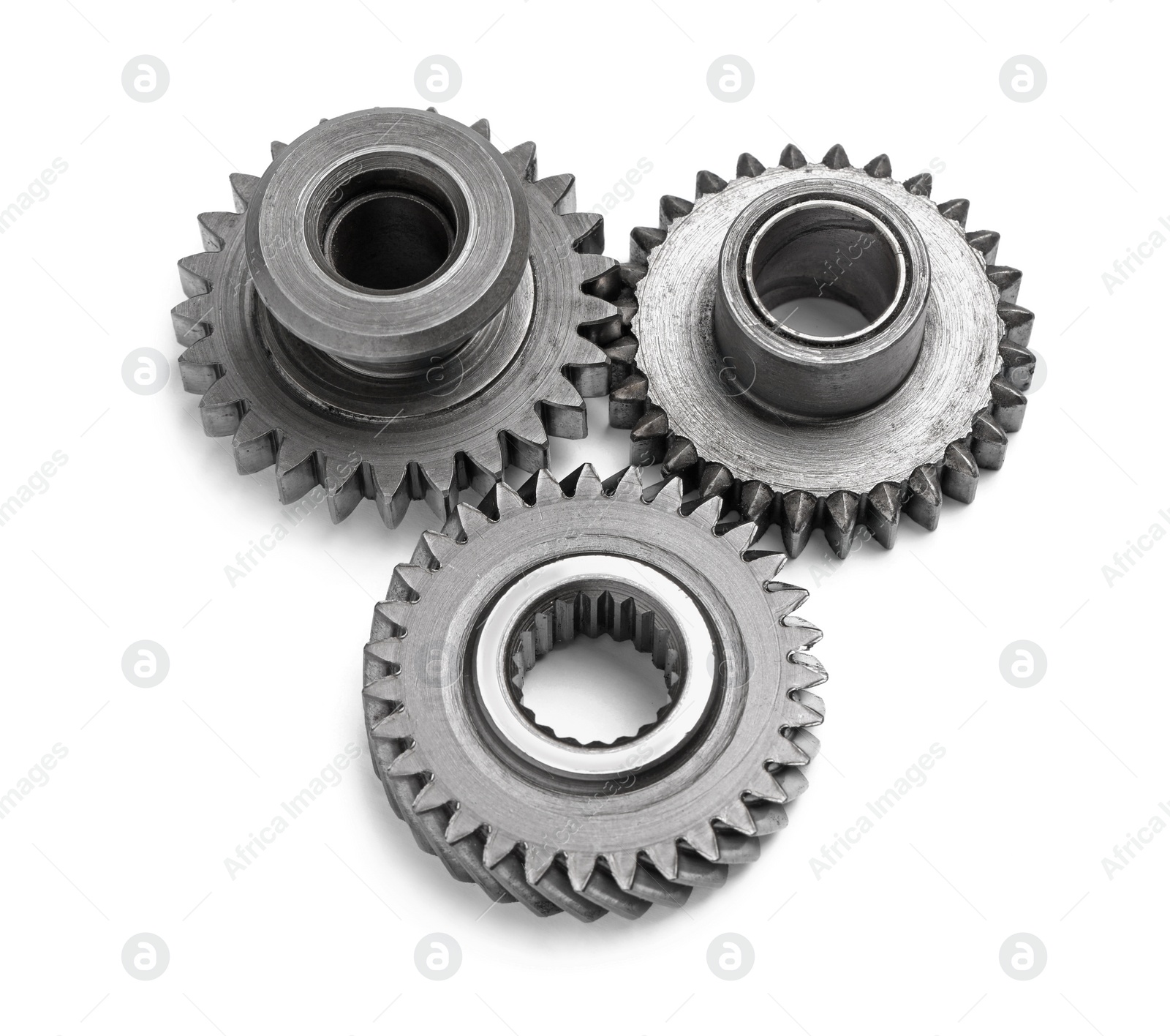 Photo of Different stainless steel gears on white background