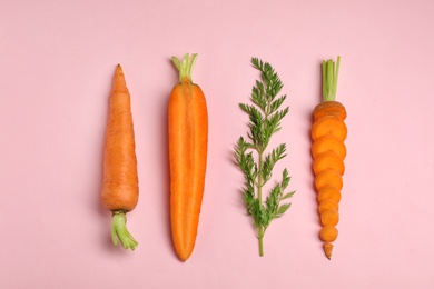 Photo of Creative flat lay composition with fresh ripe carrots on color background