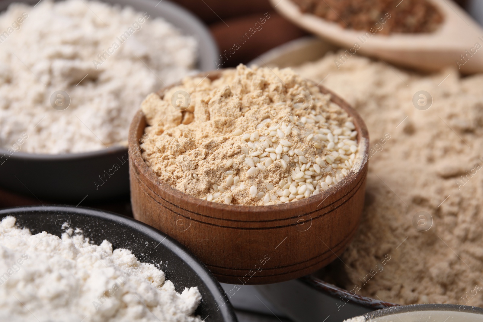 Photo of Bowls with different types of flour, closeup