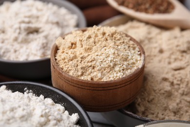 Photo of Bowls with different types of flour, closeup