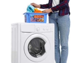 Photo of Woman with laundry basket near washing machine on white background, closeup