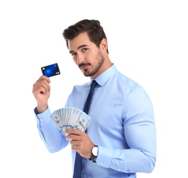 Photo of Handsome businessman with dollars and credit card on white background