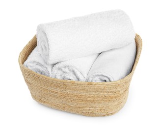 Photo of Wicker laundry basket with clean towels isolated on white