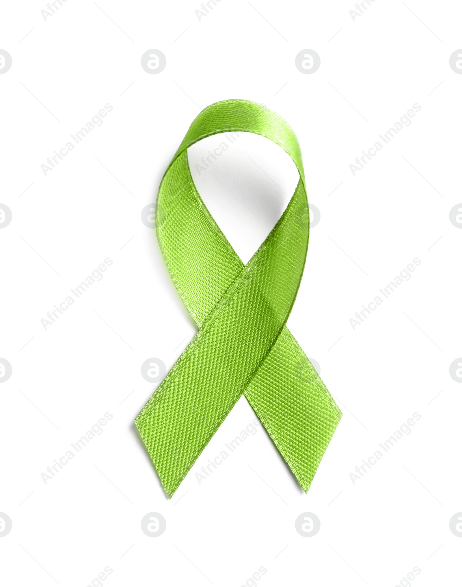 Photo of Green ribbon on white background, top view. Cancer awareness