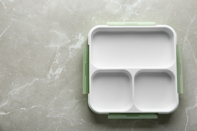 Empty lunch box on table, top view