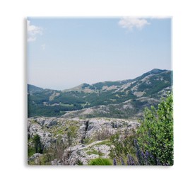 Image of Photo printed on canvas, white background. Picturesque view of beautiful mountains on sunny day