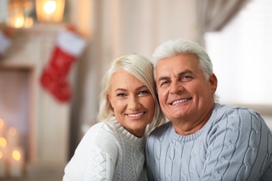 Happy mature couple at home. Christmas celebration