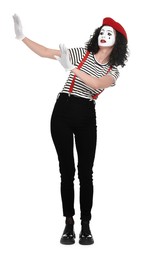 Funny mime with beret posing on white background