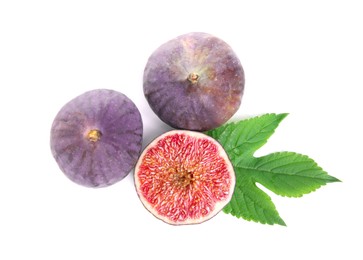 Whole and cut fresh figs with green leaf isolated on white, top view