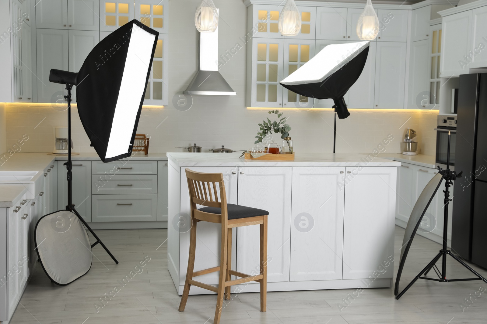 Photo of Professional photo studio equipment prepared for shooting kitchen interior